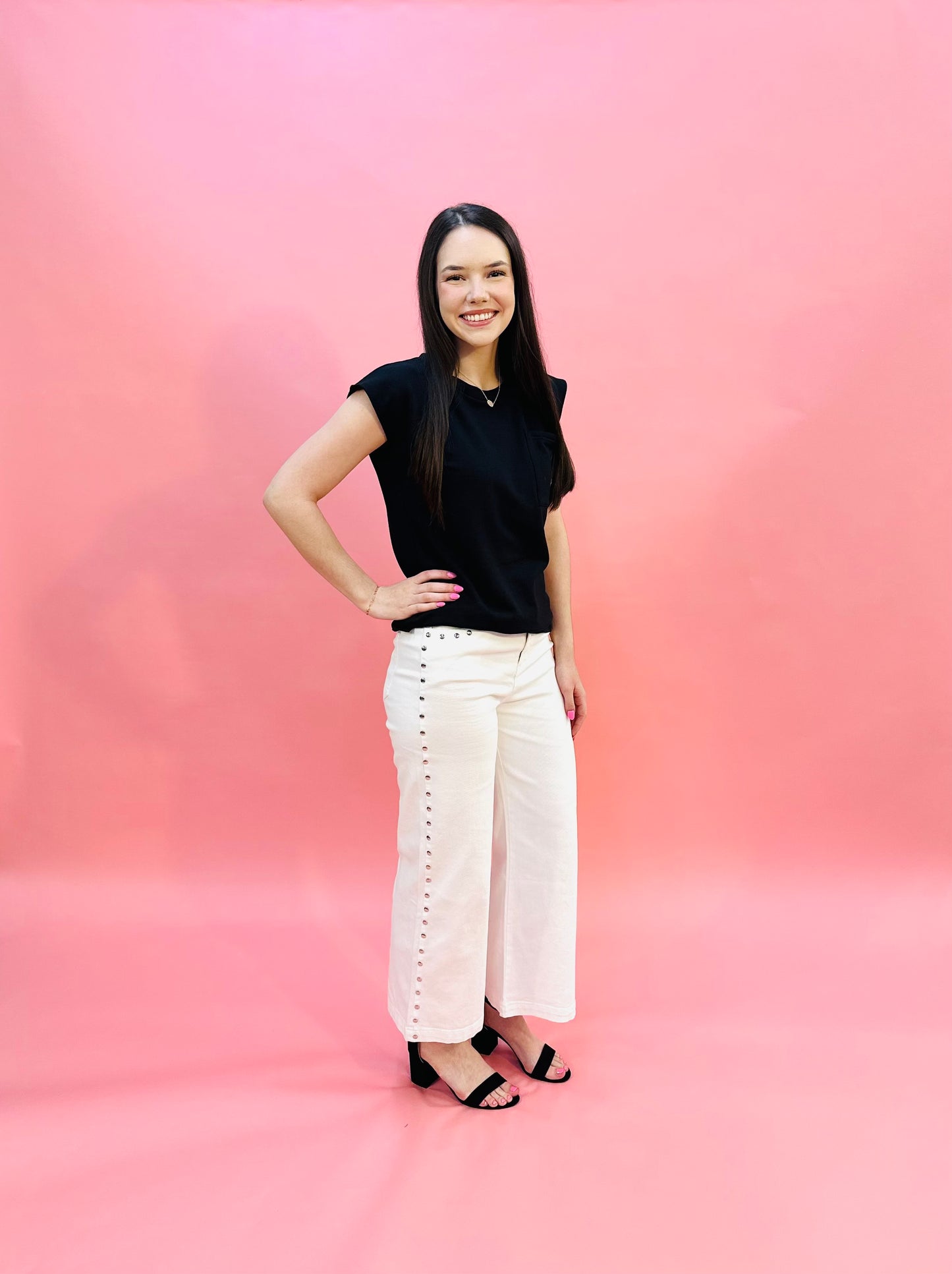 Solid high waist ankle length pants w/ silver stud embellishments. Classic five pocket button-fly front zipper closure