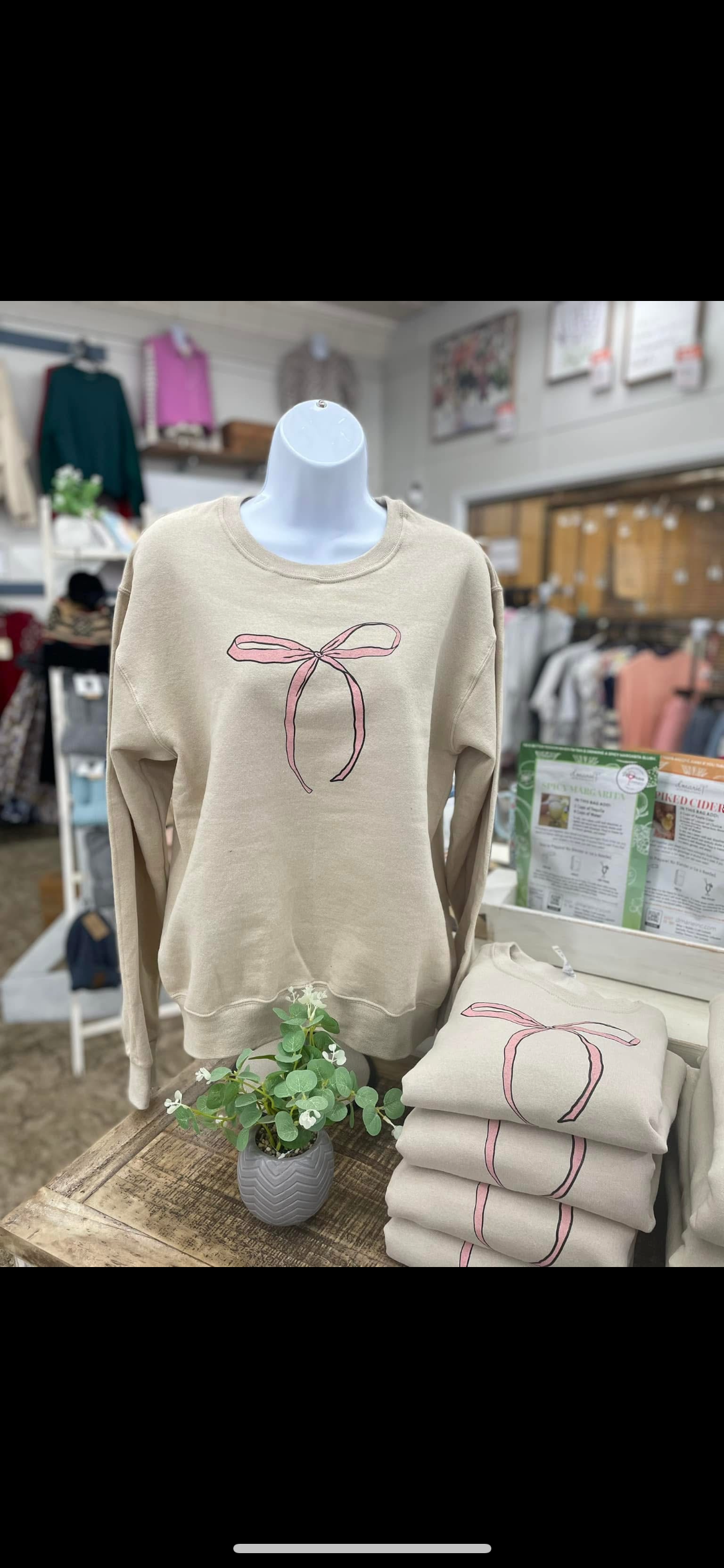 She is clothed bow sweatshirt