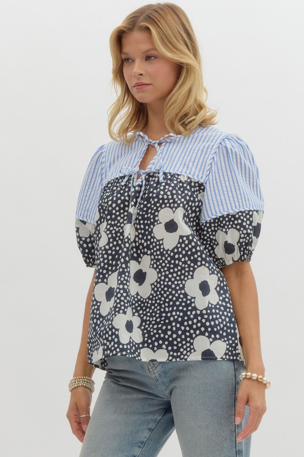 Floral print elasticized short sleeve top w/ double front tie closure