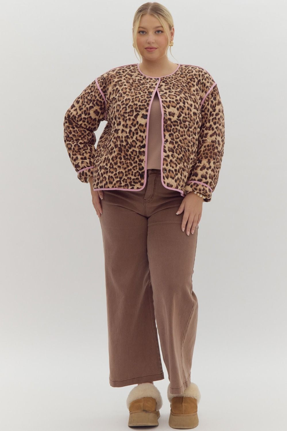 Leopard print long sleeve snap buttons jacket w/ pockets at side. Contrast trim.