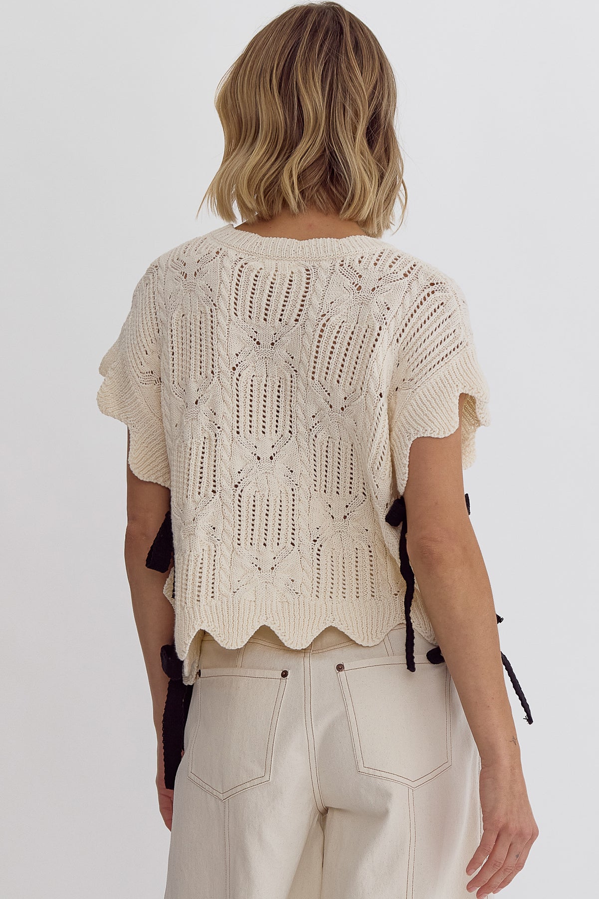 Crochet knit short sleeve crop top w/ scalloped hem self tie bow detail at sides