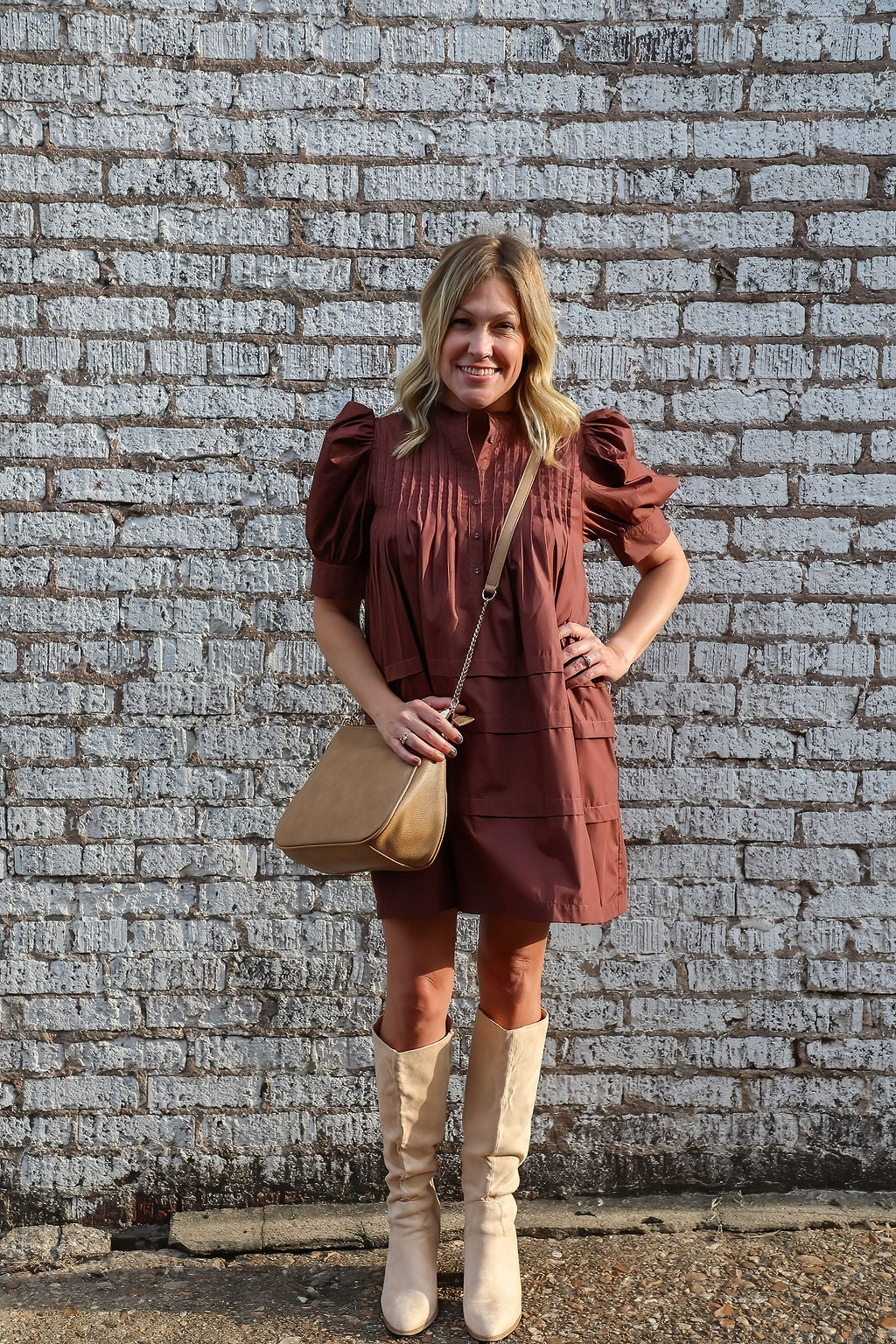 Solid pin tucked short sleeve mini dress w/ pockets, puff sleeves, & b Burnett's Boutique Solid pin tucked short sleeve mini dress w/ pockets, puff sleeves, & b Burnett's Boutique