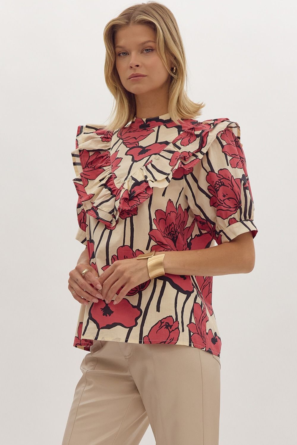 Floral print, mock neck short sleeve top w/ Ruffle overlay detail. Button at back
