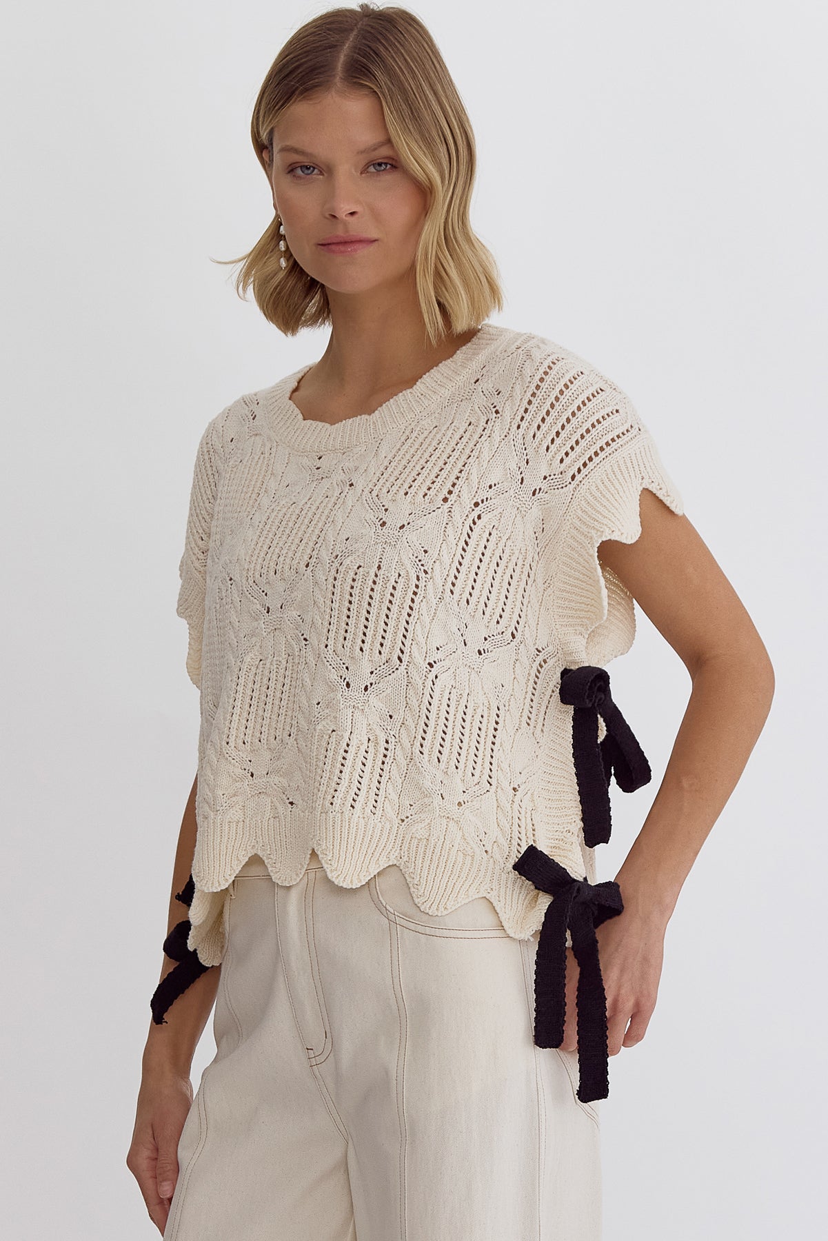 Crochet knit short sleeve crop top w/ scalloped hem self tie bow detail at sides