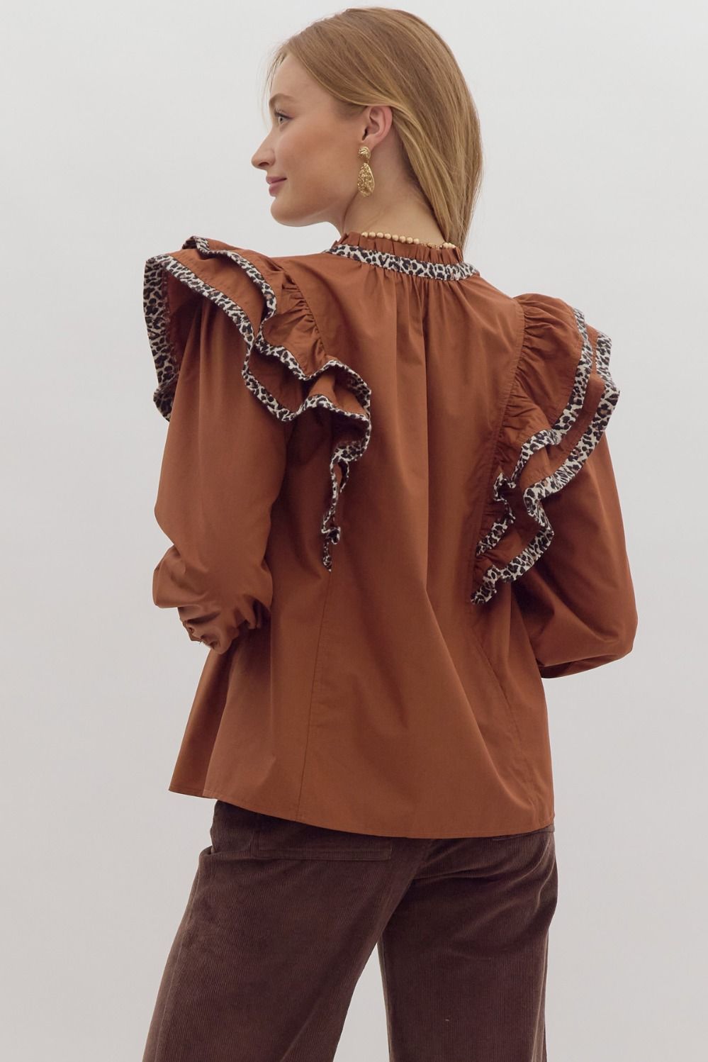 Solid long sleeve ruffled v-neck top w/ leopard print trim detail