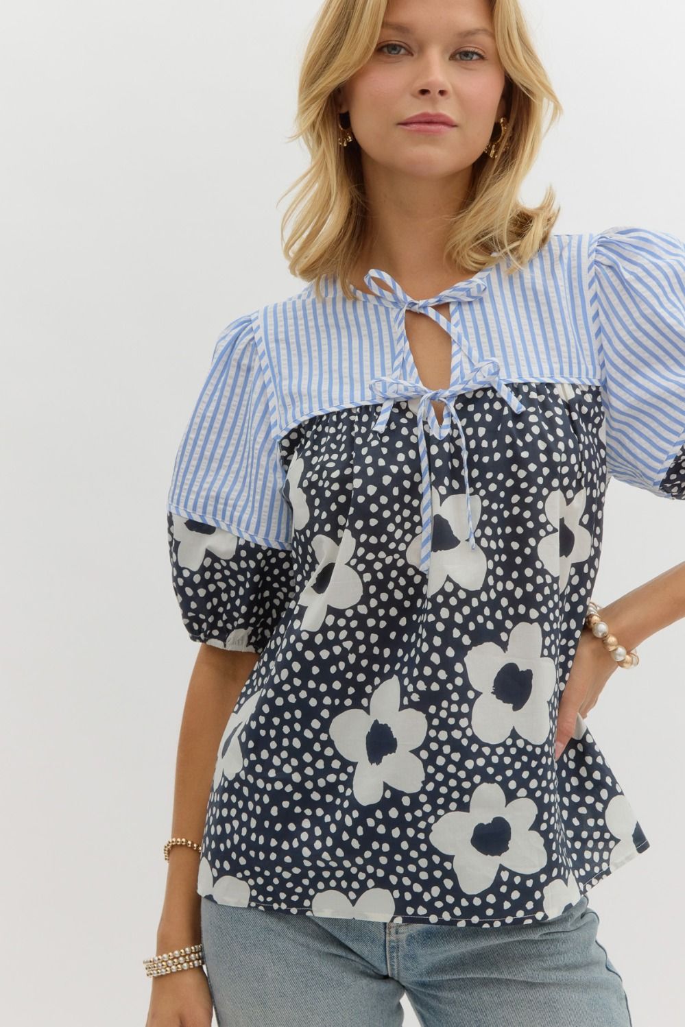 Floral print elasticized short sleeve top w/ double front tie closure