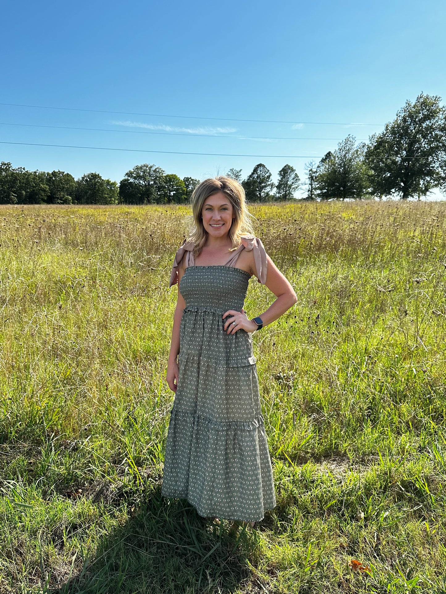 Floral print sq. neck sleeveless tiered midi dress w/ ties at shoulders. Smocking. Pockets.