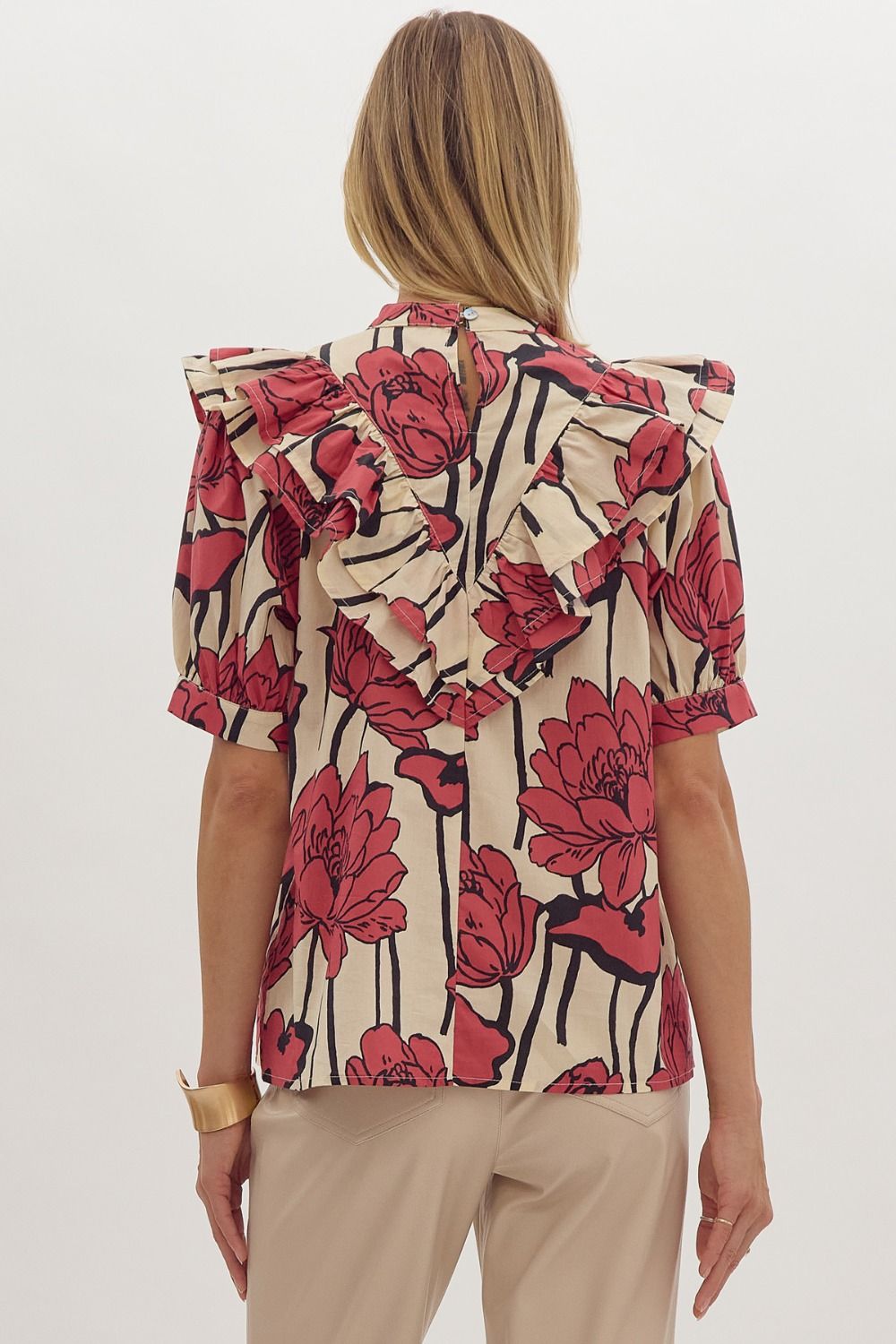 Floral print, mock neck short sleeve top w/ Ruffle overlay detail. Button at back