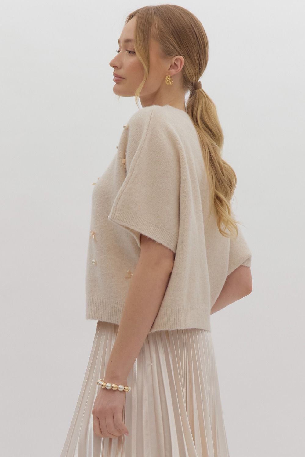 Solid knit short sleeve sweater top w/ bow & pearl embellishments