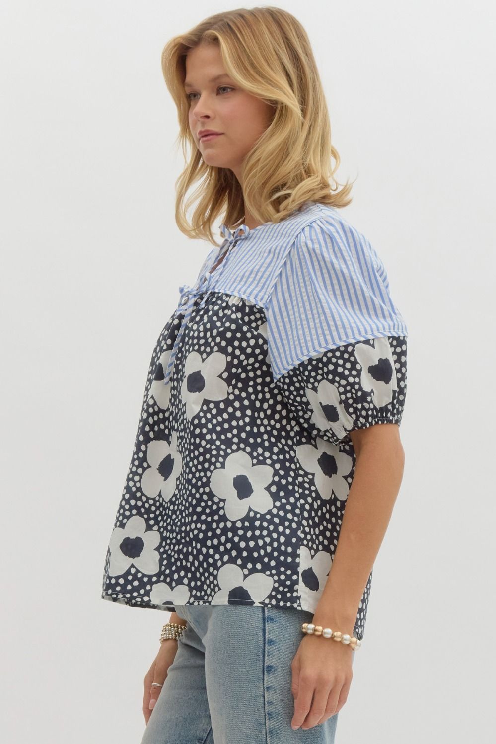 Floral print elasticized short sleeve top w/ double front tie closure