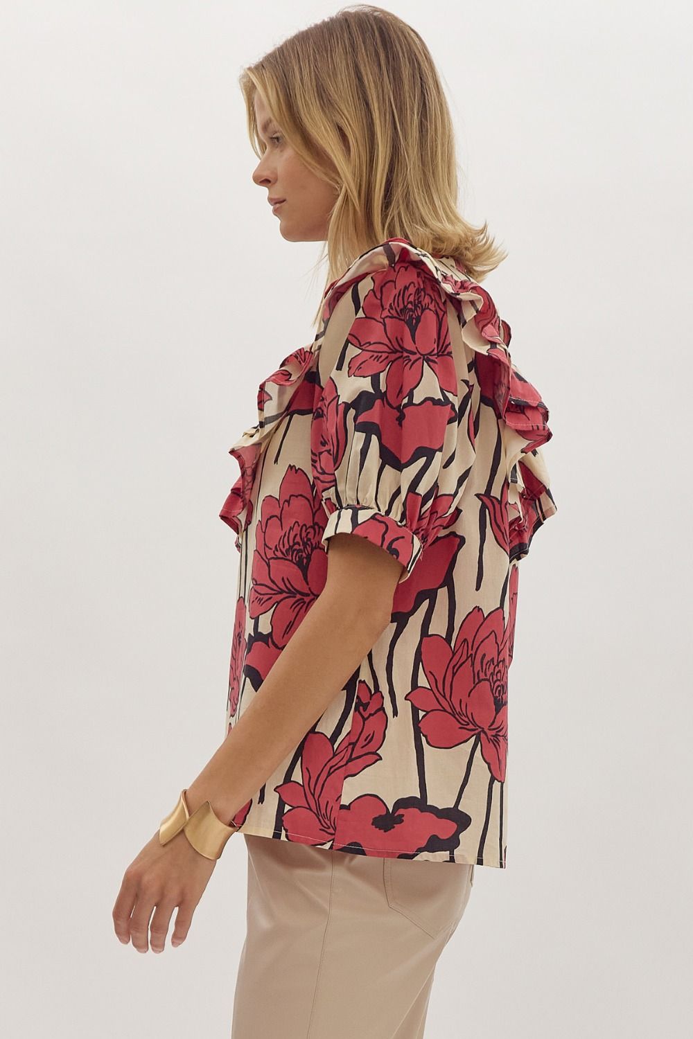 Floral print, mock neck short sleeve top w/ Ruffle overlay detail. Button at back