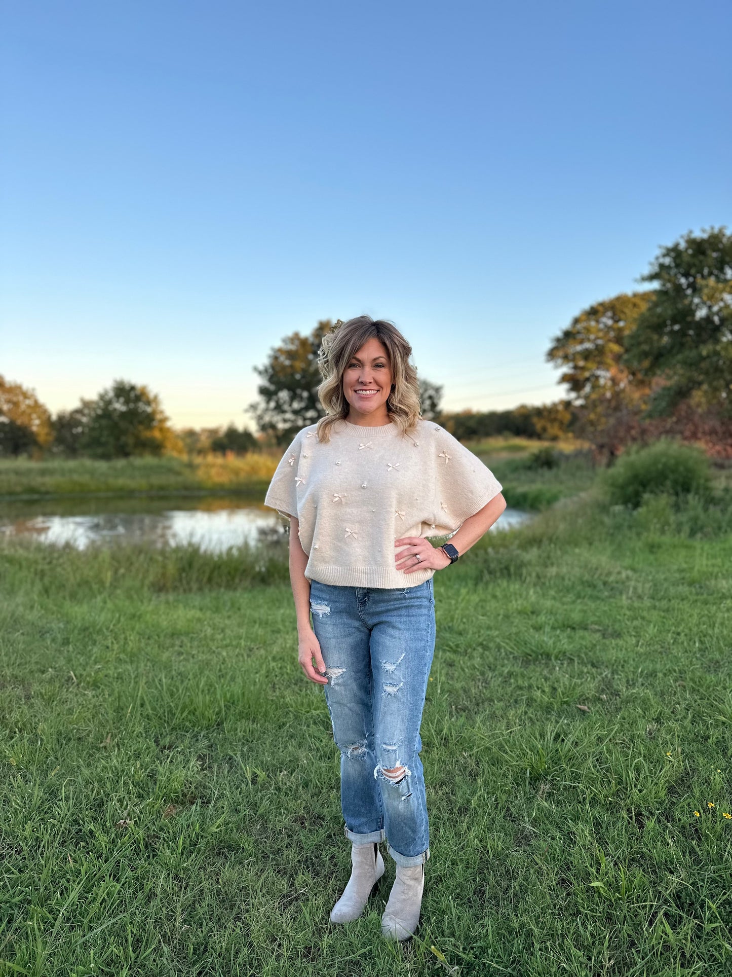 Solid knit short sleeve sweater top w/ bow & pearl embellishments