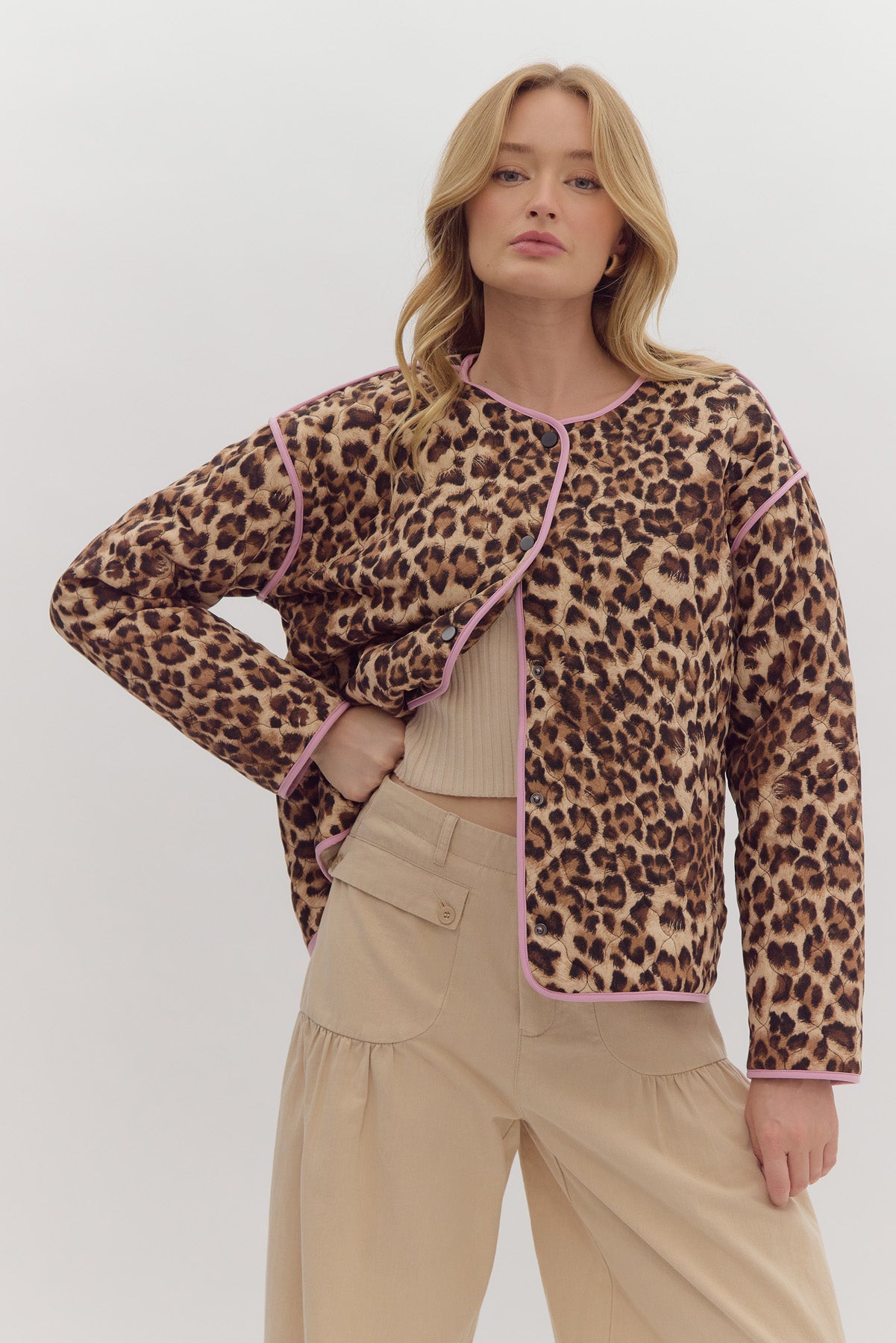 Leopard print long sleeve snap buttons jacket w/ pockets at side. Contrast trim.