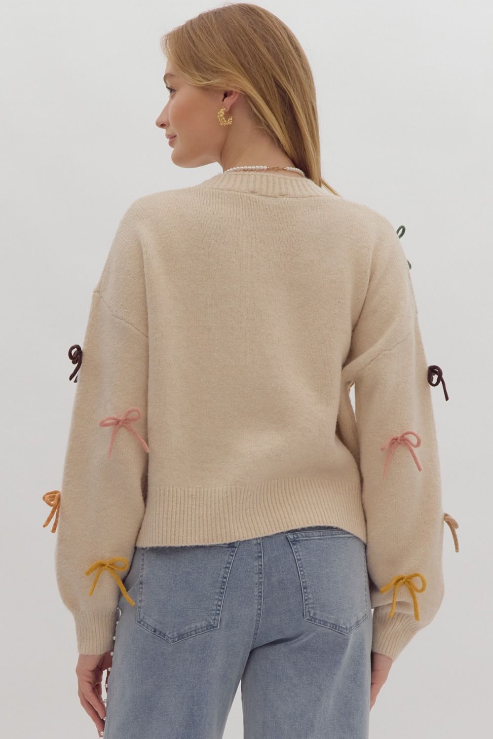 Solid long sleeve button down cropped cardigan w/ multi color bow appliqués