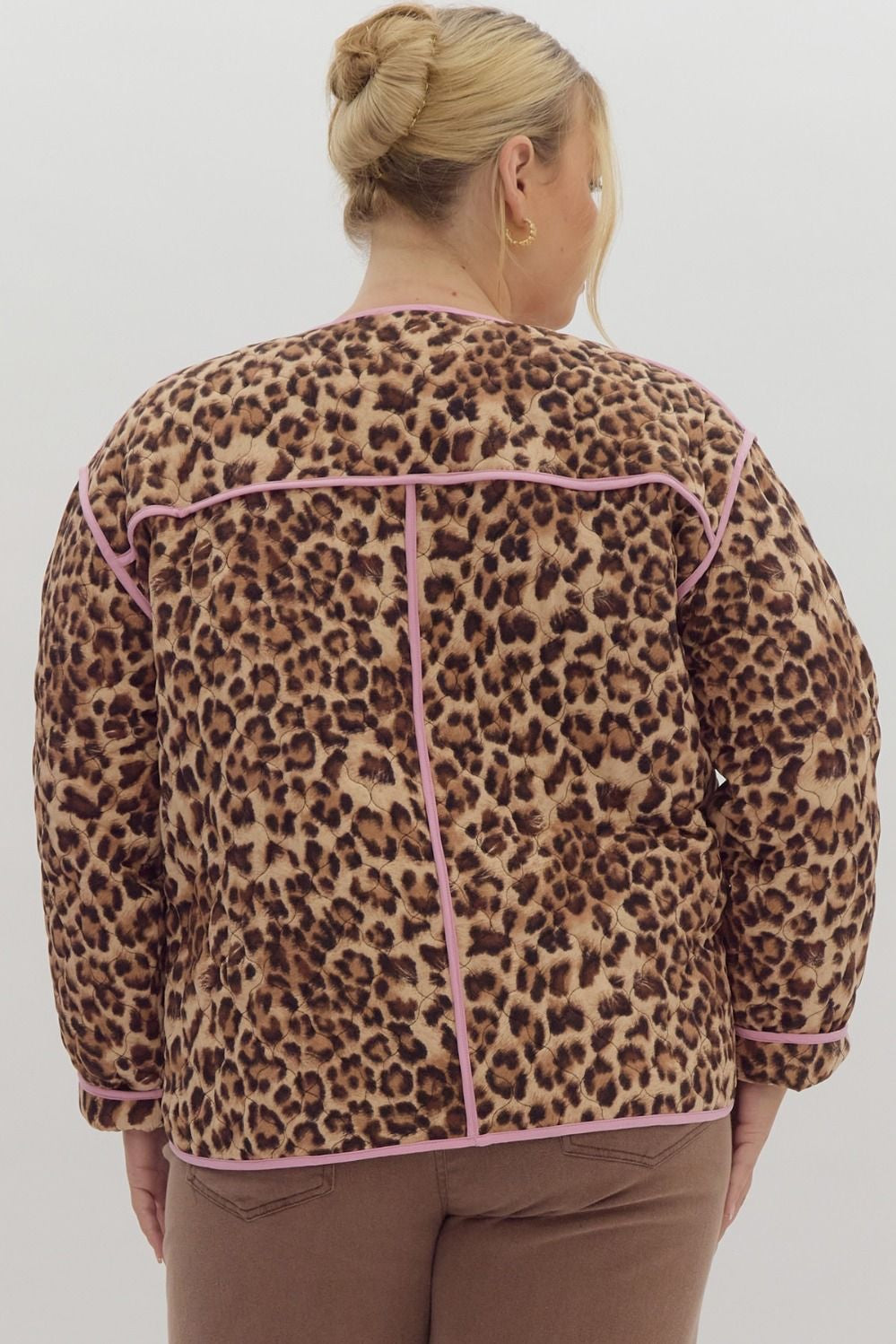 Leopard print long sleeve snap buttons jacket w/ pockets at side. Contrast trim.