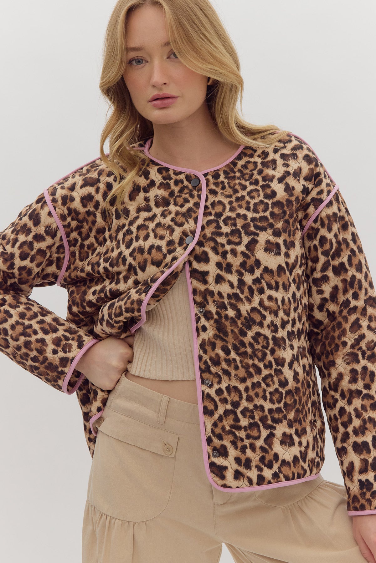 Leopard print long sleeve snap buttons jacket w/ pockets at side. Contrast trim.