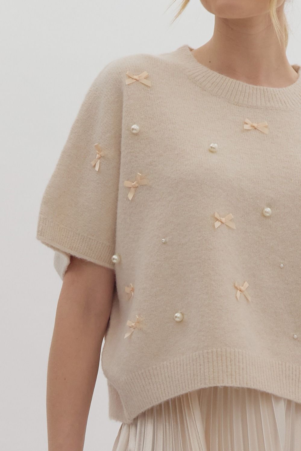 Solid knit short sleeve sweater top w/ bow & pearl embellishments