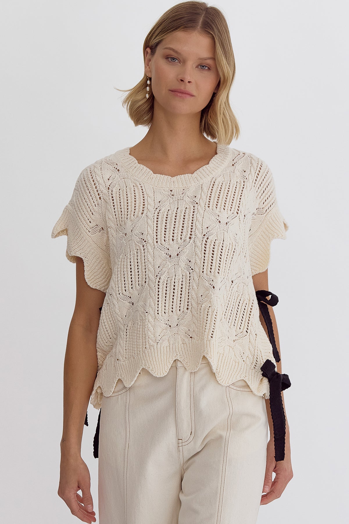 Crochet knit short sleeve crop top w/ scalloped hem self tie bow detail at sides