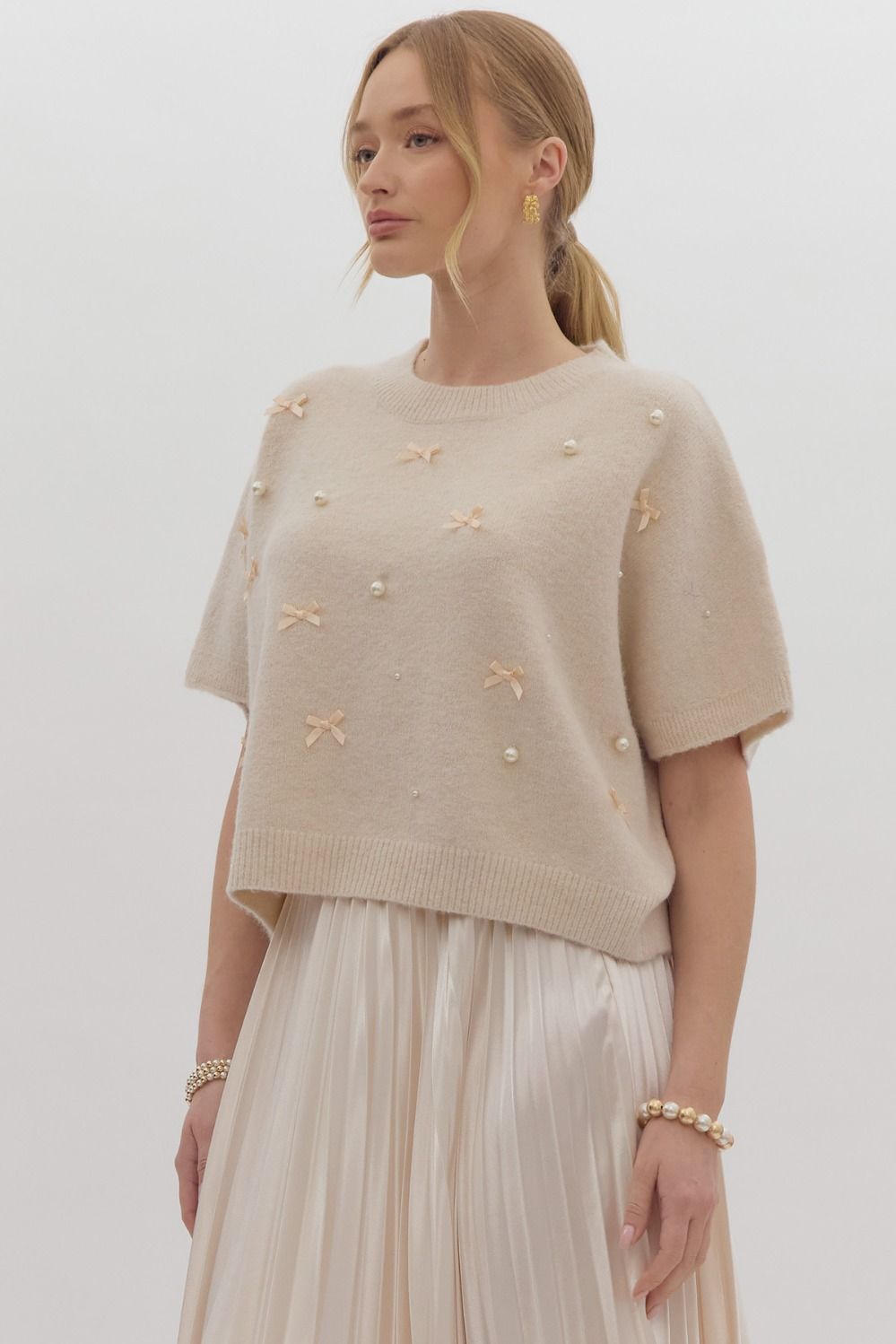 Solid knit short sleeve sweater top w/ bow & pearl embellishments